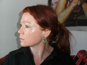 Green earrings .