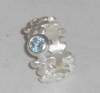 Flower ring with a topaz